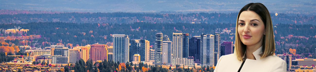 The snowy Alpine Lakes Wilderness mountain peaks rise behind the urban skyline